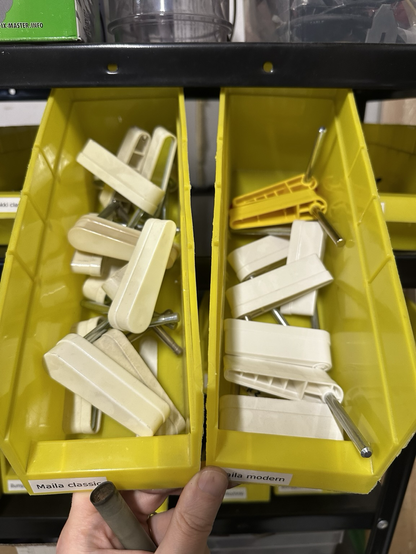 Two boxes full of pinball flippers.