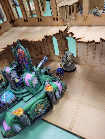Tau Steal Suit with one wound remaining, very much cornered by an Immolator that can't roll dice for beans.