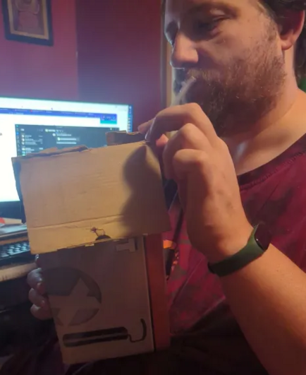 Me holding the box (for scale)