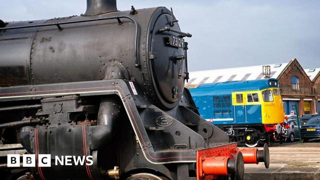 steam locomotive in the front and diesel engine the back