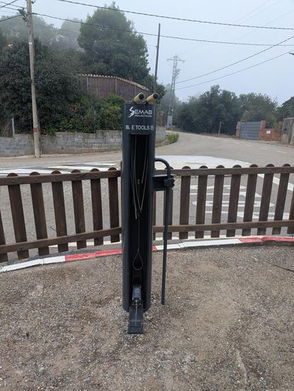 vandalised pubic bicycle repair stand