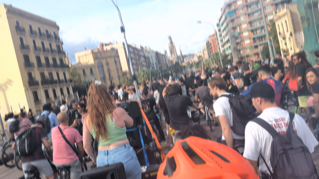 people on bikes, skates, and on foot on the road to Sagrada in Barcelona