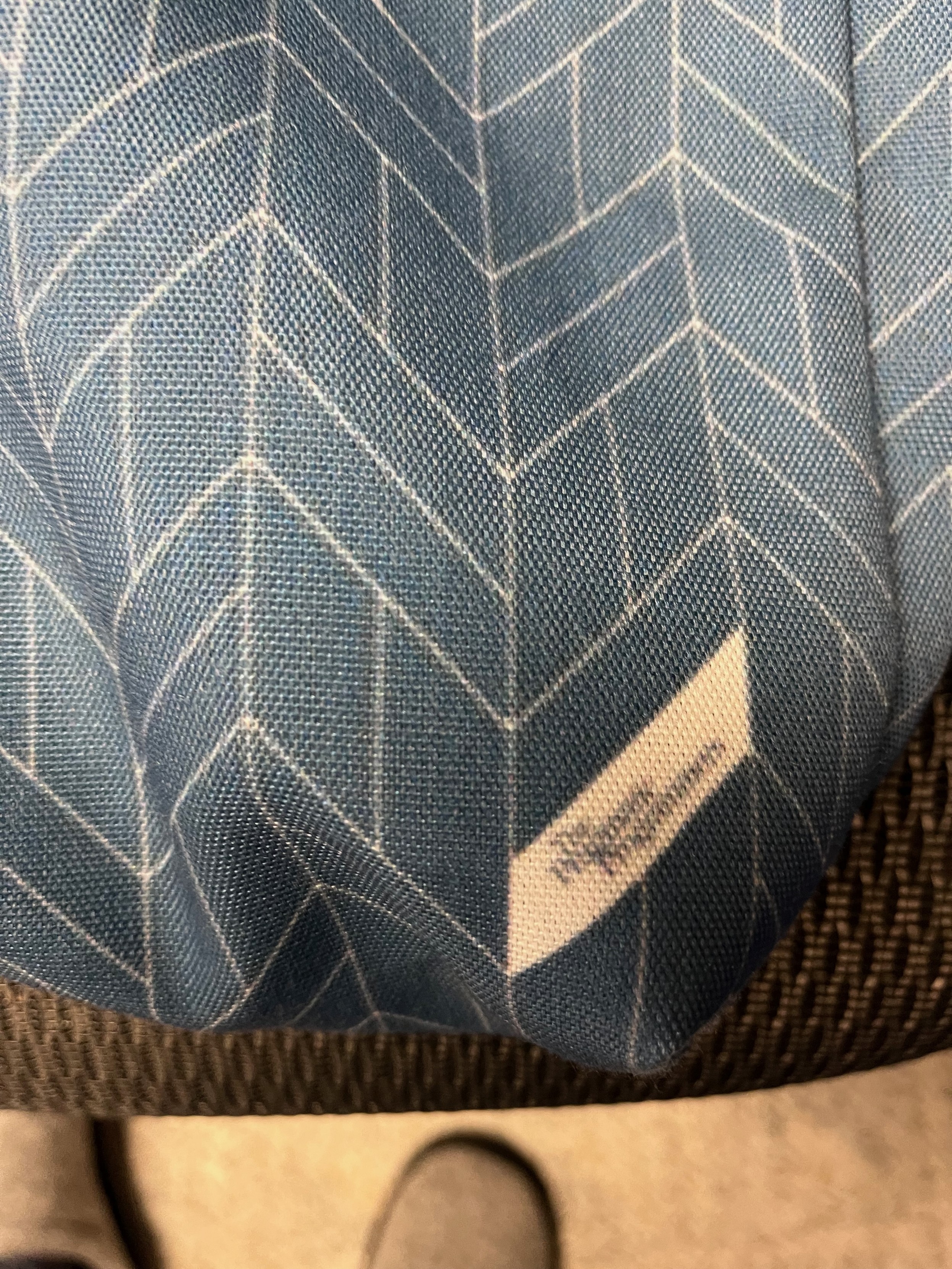 The label on the tote bag, saying “The Pragmatic Programmers, sort of blurrily.