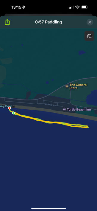 Workout screenshot showing a 57 minute paddle which is represented as a yellow and green out and back path in a body of water