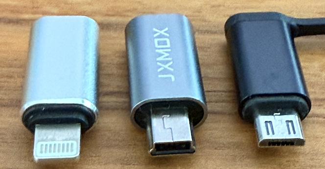 3 Adapters from left to right Lightning, USB Mini, USB Micro, all receive a USB-C cable