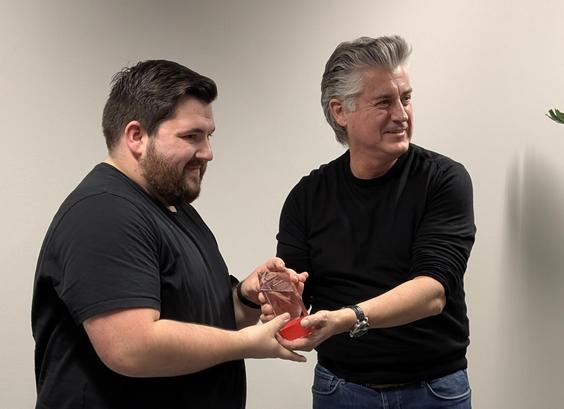 Xavier giving Marco the award