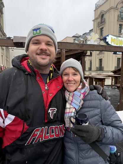 My wife and son bundled up at an outdoor bar.