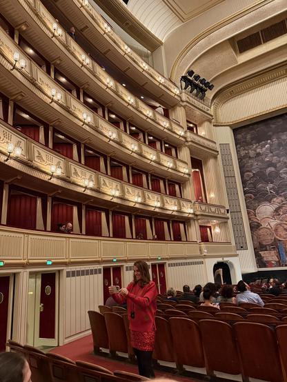 Boxes on left wall seats in front of partial view of stage