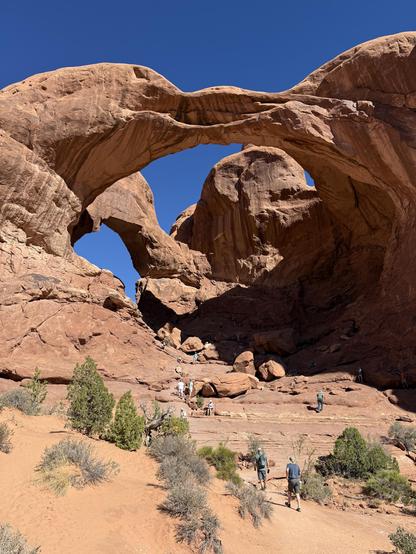 Picture of Double Arch. The largest arch in arches park.

Dark red rocks have eroded over millions of years to form what look like arches. This one is huge and has two distinct structures that look like one from many angles.