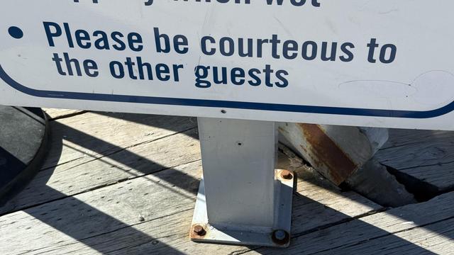 Sign reminding its reader to “please be courteous to the other guests”