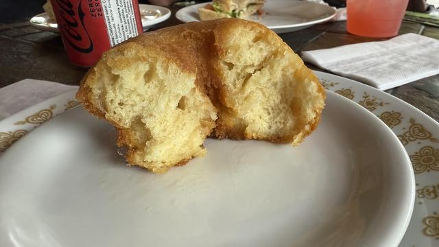 Half of a Honey’s donut, showing the inside texture.