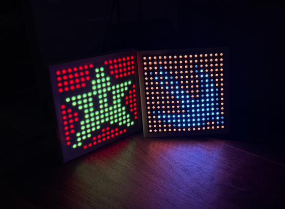 Last year’s panel (MicroPython) with this year’s prototype panel (Swift). These are 16x16 LED panels. One of them will go on top of our Christmas tree in a little more than a month.