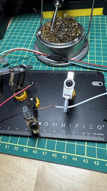 The mentioned tool, positioned on the requisite cutting mat, with a soldering iron in the background.