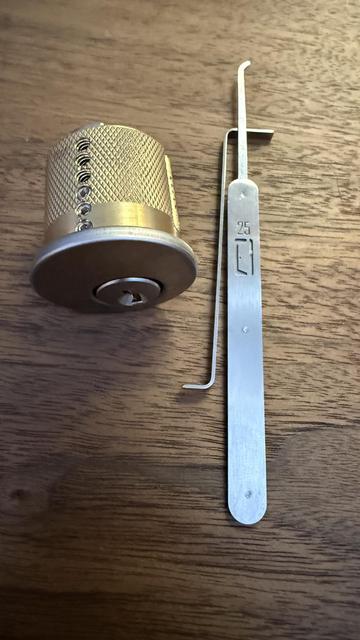 A practice lock, turning tool, and lock pick