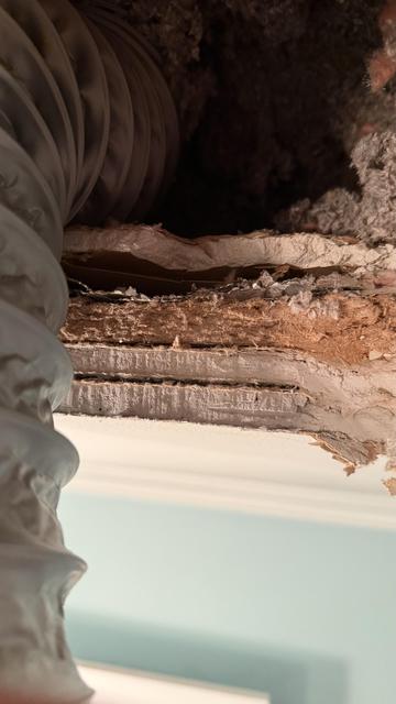 Peeking through the removed ceiling fan housing, there are at least 5 layers of former ceiling.