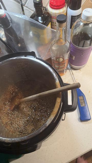Boiling syrup with an Old Grand-Dad bottle in the background.
