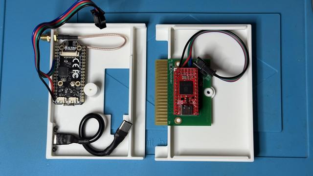 3D printed cart shell and the components inside: OneROM Fire 28 C, USB harness, HeltecV5, uart connection cable, antenna pigtail + mount