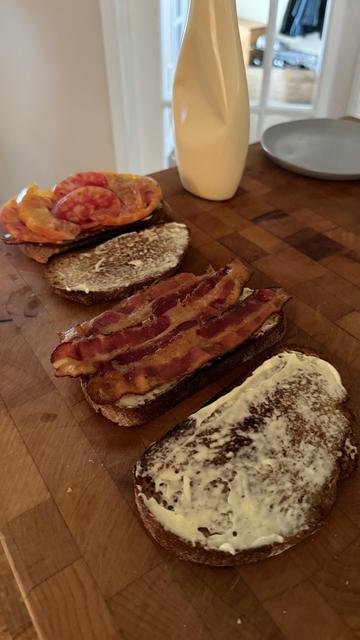 Tomato bacon sandwiches being constructed; Kewpie mayo in the background.