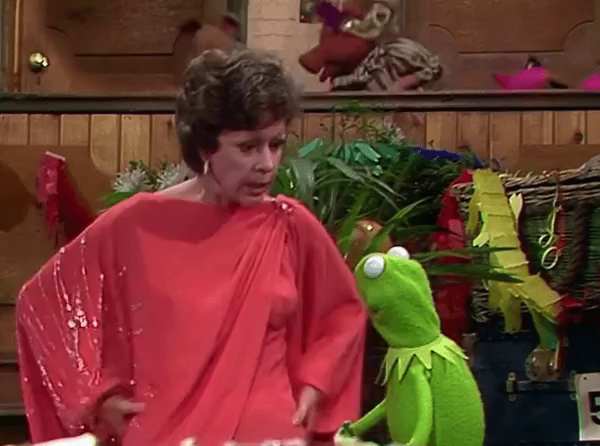 GIF of a frustrated Carol Burnett shaking Kermit the frog like a rag doll