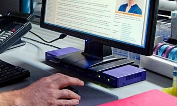 "ENHANCED" version of a purple device serving as a desktop computer prop in the show Dexter
