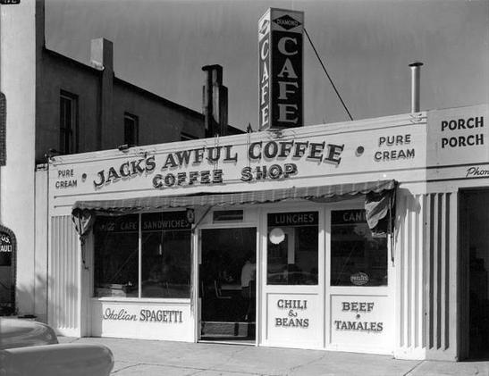 <storefront, fake flat Doric columns>
Jack's Awful Coffee
Coffee Shop
PURE CREAM PURE CREAM
Italian SPAGETTI[sic] 
Chili & Beans
Beef Tamales
<next door: Porch Porch>