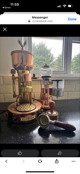 A photo of the machine itself. It’s bronze and brass coloured and looks akin to an old steam engine