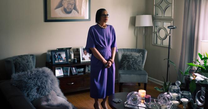 Deondra Kimble near a drawing of her late nephew, Michael David, in Louisville, Ky.