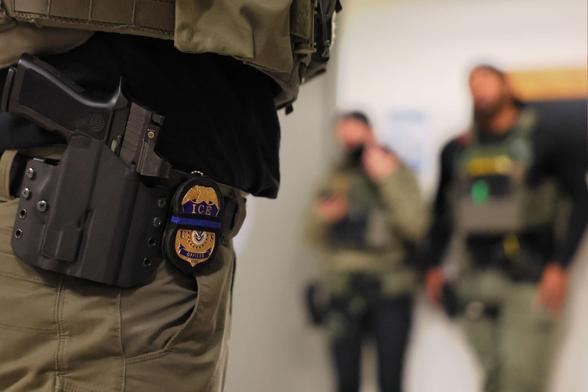 An ICE officers badge is seen as federal agents patrol the halls of immigration court at the Jacob K. Javitz Federal Building on June 10, 2025, in New York City.