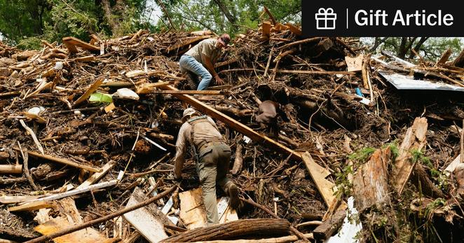 A cadaver dog was used to search for human remains among the rubble near the Guadalupe River in Kerrville, Texas.
