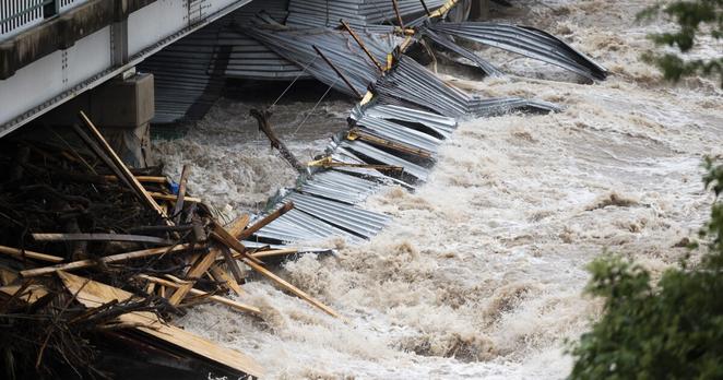 Floodwater crashes through a bridge over San Gabriel River in Georgetown on Saturday.