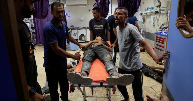Casualties were brought into Nasser Hospital in southern Gaza on Wednesday after a stampede at a food distribution site.