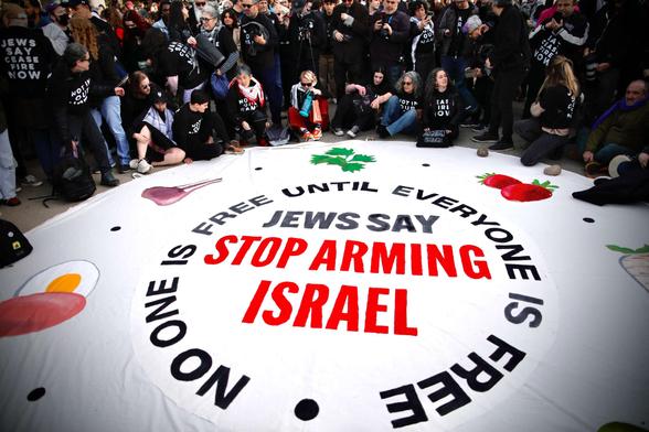 Jewish protesters demonstrate near the home of Senate Majority Leader Chuck Schumer during the second night of Passover, calling on Schumer to stop arming Israel, on April 23, 2024.