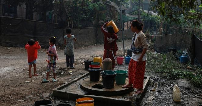 Refugees collect water at Mae La refugee camp in Thailand
