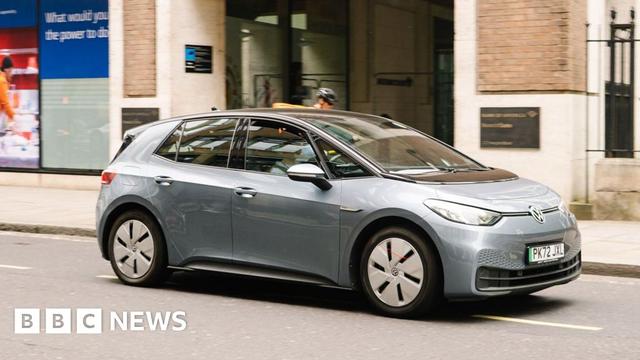 A silver ID.3 Volkswagen vehicle is being driven along a road in London.