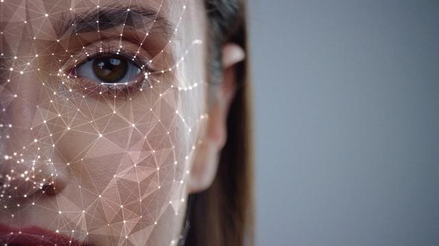 A stock image of a woman's face with a biometric pattern on top of it. | Image: Fractal Pictures/Shutterstock.com