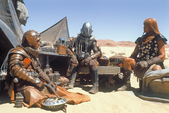 Space mercenaries sitting around a desert camp