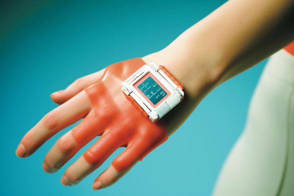 Close-up of a wrist wearing a red glove and digital smartwatch.