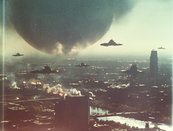Cityscape with hovering disk-shaped aircraft and a large spherical object in the sky.