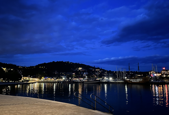 Portoroz coastline with the harbour and the lights by night.