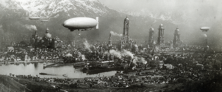 Aerial view of a steampunk cityscape with large airships and towering buildings, set against a backdrop of snow-capped mountains.