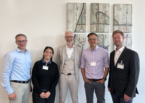 From left to right: Chris Eberl (IWT Freiburg), Abril Azocar Guzman (FZ Jülich), Harald Sack (FIZ Karlsruhe), Joerg Waitelonis (FIZ Karlsruhe), Markus Schilling (BAM), standing in front of some paintings at Rhein Sieg Halle in Siegburg.