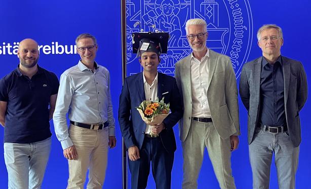 From left to right: Edoardo Milans, Chris Eberl, Akhil Tomas wearing the Hand-crafted doctoral hat, Harald Sack and Oliver Amft 