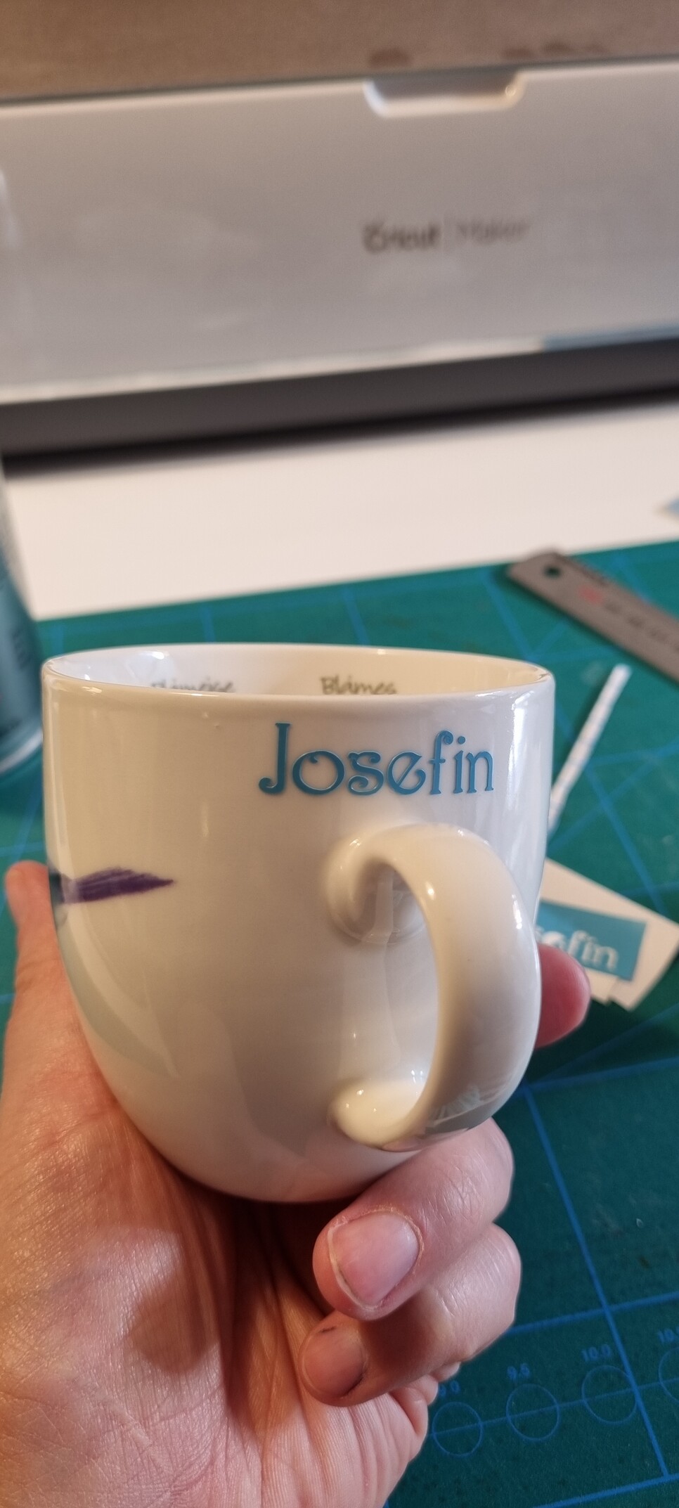 The handle side of the same cup has the name "Josefin" written in semi fancy font.
