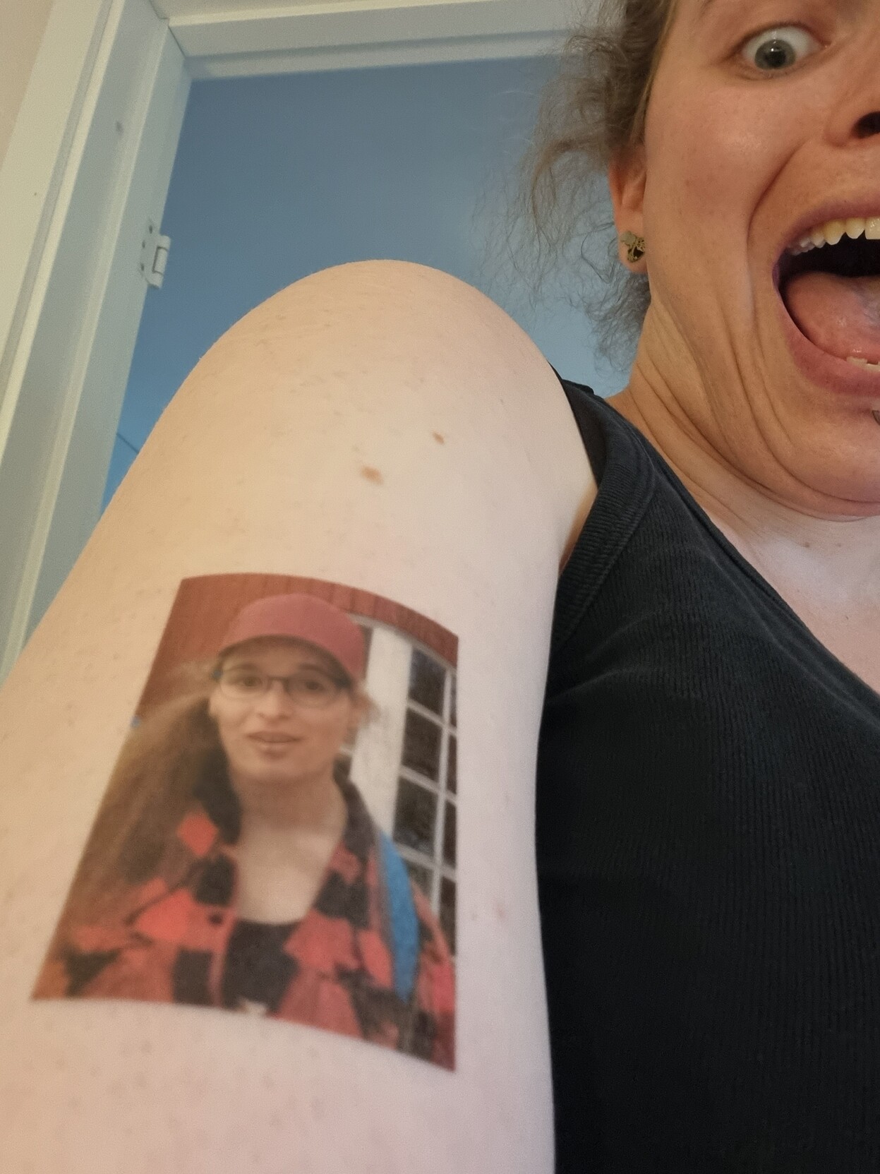 It's a picture of me in temporary tattoo form on my arm. The real me is looking a slight bit panicky.
