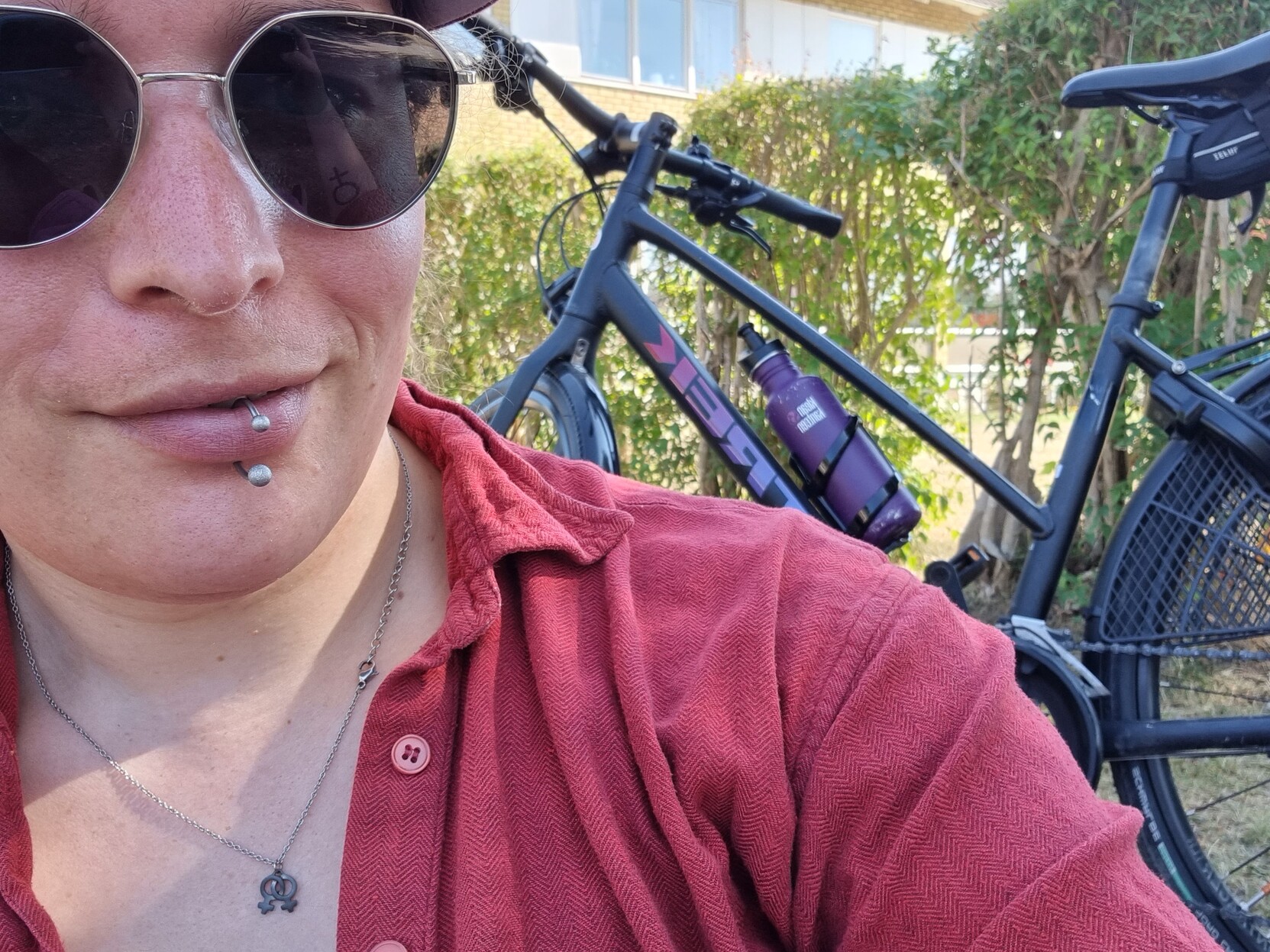 Me in front of my bike again. A non descript house is visible in the background.