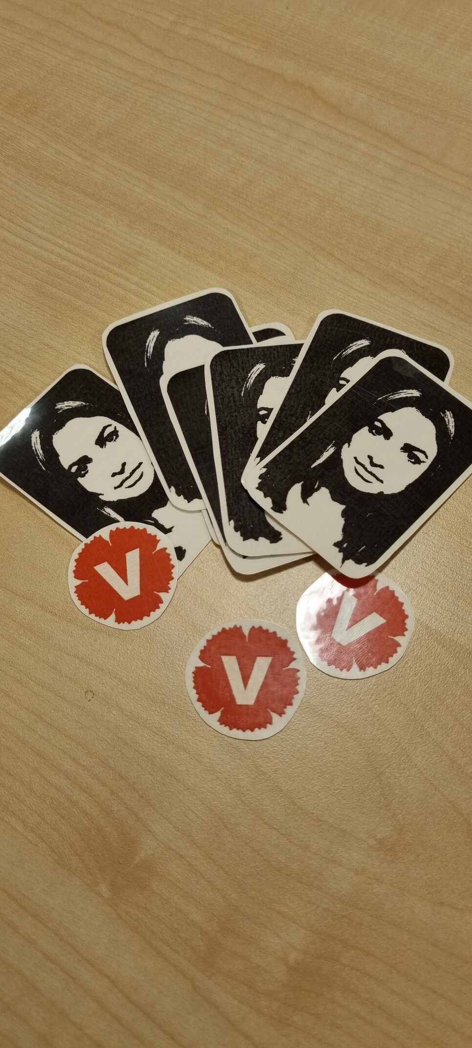 Temporary tattoos of the swedish left party leader nooshi and some party logos.