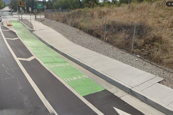 green bicycle lane and pedestrian sidewalk