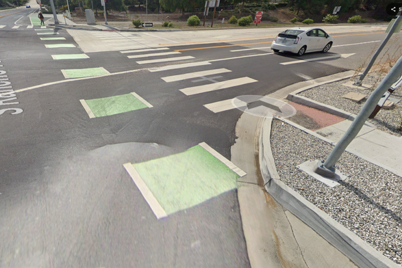 Green bicycle lane and pedestrian crosswalk