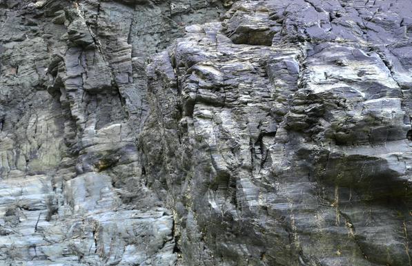 Angular and irregular surface of cliff.