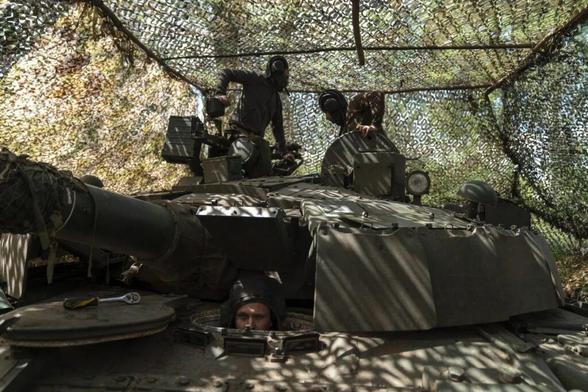 A group of Ukrainian military engineers and army tankmen prepare and maintain a T80 tank, captured in the fighting between the Ukrainian army and Russian soldiers, by placing it in a new position in Kostiantynivka district in Donetsk Oblast, Ukraine
